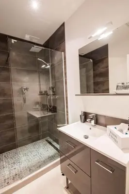 a bathroom with a shower and a sink at l'Ecrit Vin in Rustiques