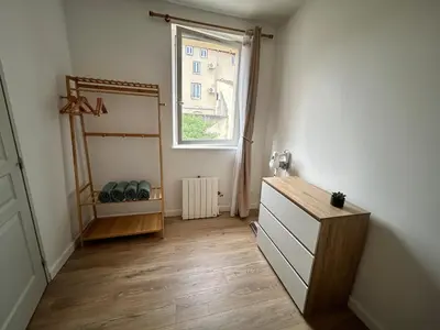 a room with a dresser and a window at Appartement au calme commerces à proximité in Castres