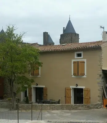 a house with turrets on the roof at Domaine Fontgrande Gîte in Carcassonne
