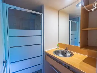 a bathroom with a sink and a mirror at Chalet 6 personnes avec Terrasse - API-1-52-233 in Fenouillet