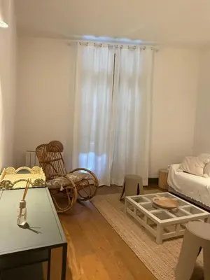 a living room with a couch and a table at appartement lumineux cosy 4 couchages coeur de narbonne in Narbonne