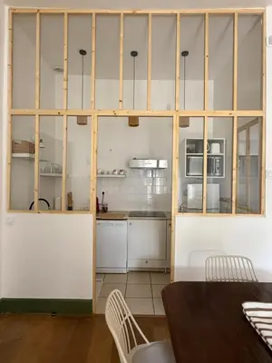 a kitchen with white cabinets and white appliances at appartement lumineux cosy 4 couchages coeur de narbonne in Narbonne