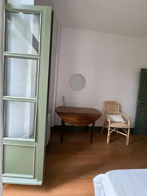 a room with a table and a chair and a desk at appartement lumineux cosy 4 couchages coeur de narbonne in Narbonne