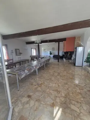 a large room with a long long table in it at La Maison de Pierre in Manses