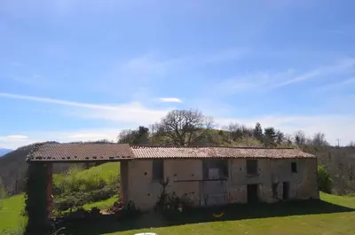 an old house on top of a hill at La Maison de Pierre in Manses