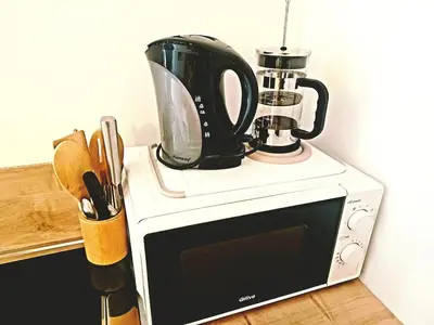a microwave with a coffee pot on top of it at Studio Garrevaques Calme et Charme à la Campagne - Lauren in Garrevaques