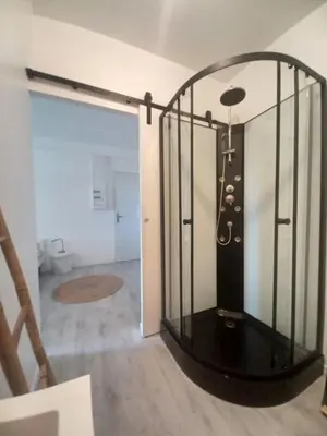 a room with a glass door with a lamp in it at Studio Garrevaques Calme et Charme à la Campagne - Wendy in Garrevaques