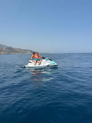 two people sitting on a jet ski in the water at Authentic fisherman's house Maison de pêcheur authentique in Port-la-Nouvelle
