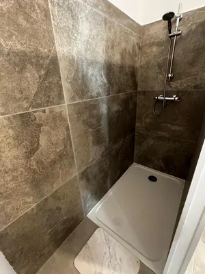 a bathroom with a shower with a toilet at Entre Campagne et Ville in Marcorignan