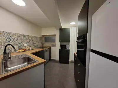 a kitchen with a sink and a counter top at La Casita Sigean in Sigean