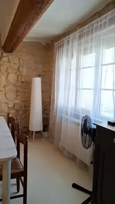 a room with a window with a white curtain at La Casita Sigean in Sigean