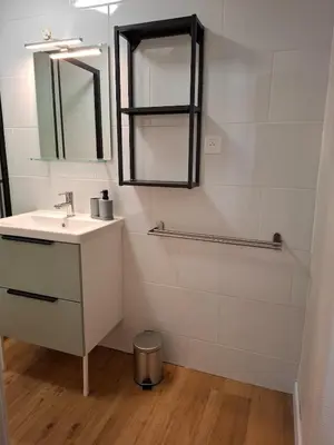 a bathroom with a sink and a mirror at La Casita Sigean in Sigean