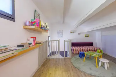 a living room with a couch and a table at villa sophora - piscine toboggan aquatique privée in Conilhac-Corbières