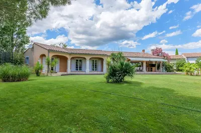 a house with a large yard in front of it at villa la combe blanche - toboggan aquatique privée in Pépieux