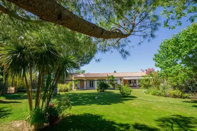 an exterior view of a house with a yard at villa la combe blanche - toboggan aquatique privée in Pépieux