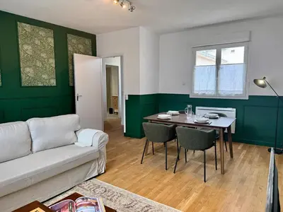 a living room with a couch and a table at Le Mahuzies 6 - Hypercentre in Castres