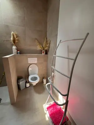 a shower with a shower head in a bathroom at maison Odjas in Saint-Laurent-de-la-Cabrerisse