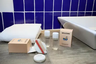 a bathroom with a bath tub and a box of products at Confort & espace avec climatisation - T4 central in Villefranche-de-Lauragais