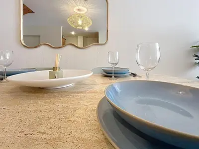 a bedroom with a bed with two pillows at Les Colonnes - Appartement en duplex - Wifi in Narbonne