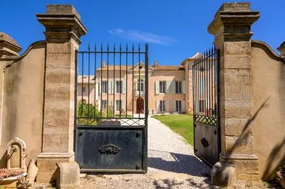 an entrance to a building with a large gate at Domaine de Puychêne in Saint-Nazaire-dʼAude