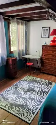 a living room with a rug on the floor at jolie appartement en rez de chaussée in Quillan