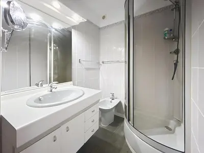 a bathroom with a sink and a shower and a toilet at Le Luxembourg - Appartement proche des Halles - Wifi in Narbonne