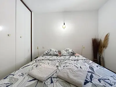 a bedroom with a bed with two pillows on it at Le Luxembourg - Appartement proche des Halles - Wifi in Narbonne