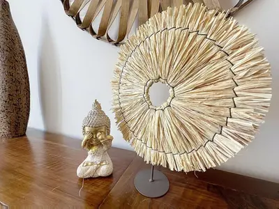 a sculpture of a head next to a fan at Le Luxembourg - Appartement proche des Halles - Wifi in Narbonne