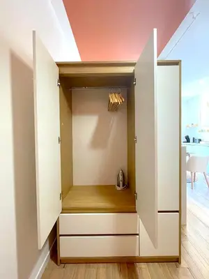 a built in closet with white cabinets at Le Sirocco - Studio Confort Lit Queen Size in Mazamet