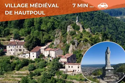 a picture of a village on a hill with a statue at Le Sirocco - Studio Confort Lit Queen Size in Mazamet