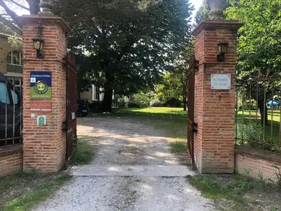 an entrance to a house with a brick gate at La Bastide De Negra in Montesquieu-Lauragais