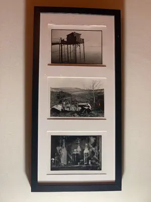 two framed photographs of a pier on a wall at La Bastide De Negra in Montesquieu-Lauragais