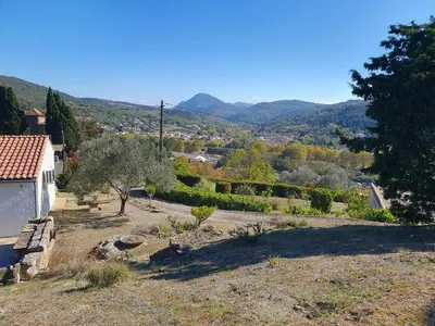 a view of a garden with mountains in the background at Le Gîte Sambacacia in Montazels