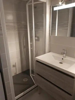 a bathroom with a sink and a shower at Vagues et Vignes Gruissan Corbières in Gruissan