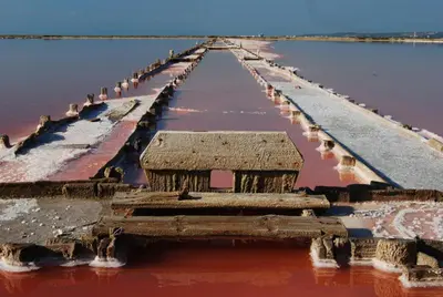 a long pier in the middle of the water at Vagues et Vignes Gruissan Corbières in Gruissan