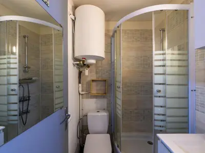 a bathroom with a toilet and a shower at Apartment Gruissan Port-5 by Interhome in Gruissan
