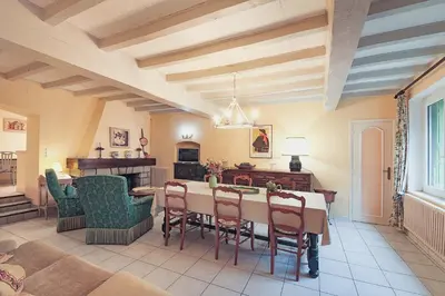a dining room with a table and chairs at Le Refuge du Tarn - Grand Jardin in Puylaurens