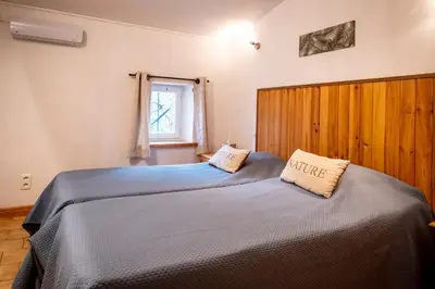 two beds sitting next to each other in a bedroom at Mas Les Albas in Felluns