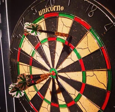 a close up of a dartboard with the wordento at Mas Les Albas in Felluns