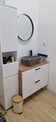 a bathroom with a sink and a mirror at villa proche carcassonne avec piscine chauffée intérieur in Villesequelande