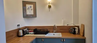 a kitchen with a sink and a counter top at Maison Barbaira