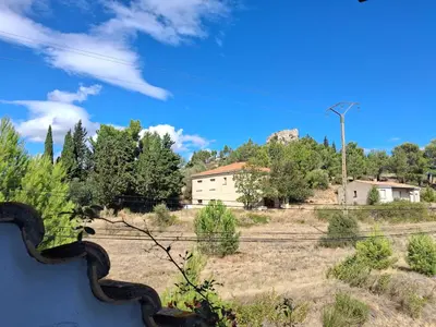 a view of a field with houses and trees at Appartement Atypique Corbières in Montséret