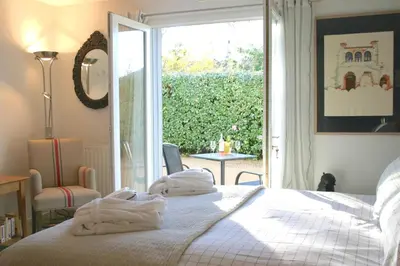 a bedroom with a bed with towels on it at B&B-Les Balcons de Maragon in Carcassonne