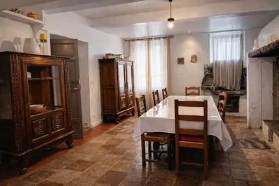 a dining room with a table and chairs at Les 2 Petits Lapins in Luc-sur-Orbieu