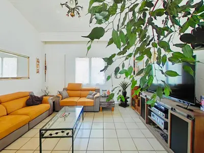 a living room with a couch and a tv at Serinity Villa - Piscine - proche Castres in Viviers-lès-Montagnes