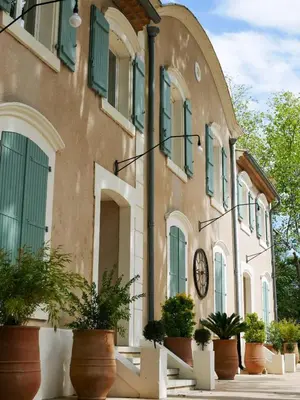 a building with a clock on the side of it at Casa Bonnafous in Villesèque-des-Corbières