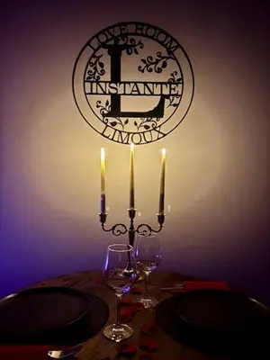 a bottle of wine and two wine glasses on a counter at Love Room L'instanté - 