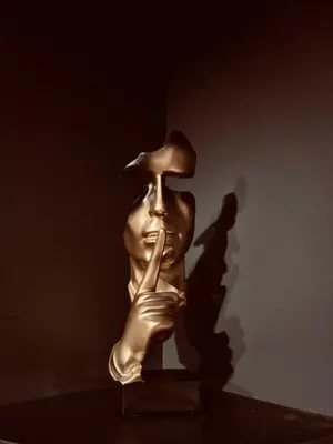 a table with two candles and two statues on it at Love Room L'instanté - 