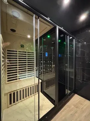 a room with a glass shower in a building at Love Room L'instanté - 