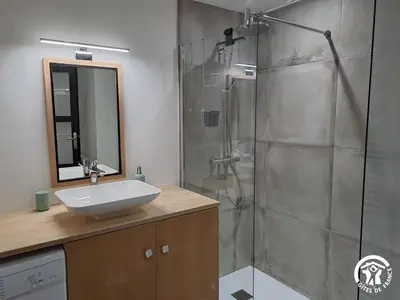 a bathroom with a sink and a shower at Gîte de l'atelier in Sorèze in Sorèze